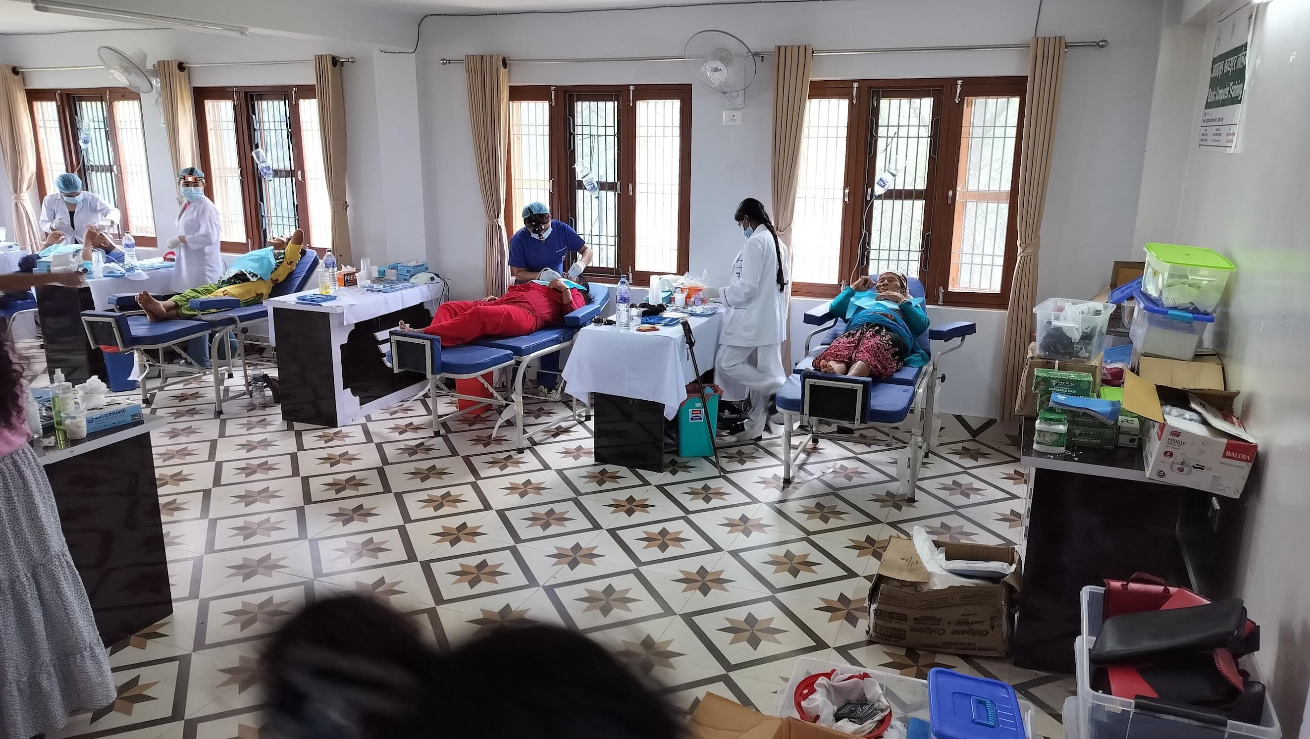 Several portable dental treatment stations serving patients during the Dhading dental camp.