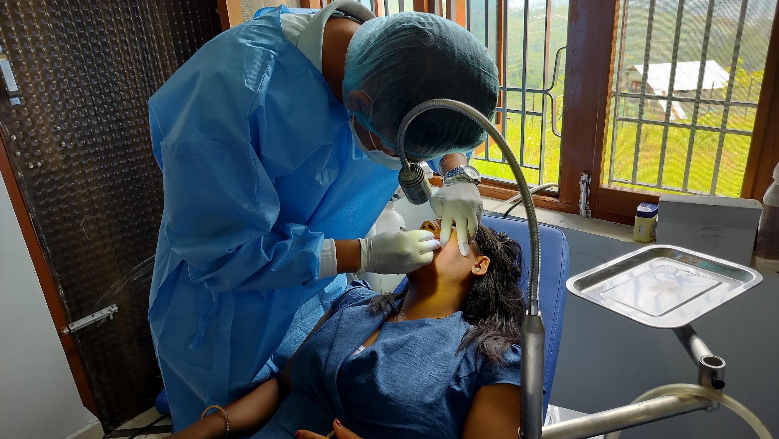 A dentist providing treatment during the Dhading dental camp.