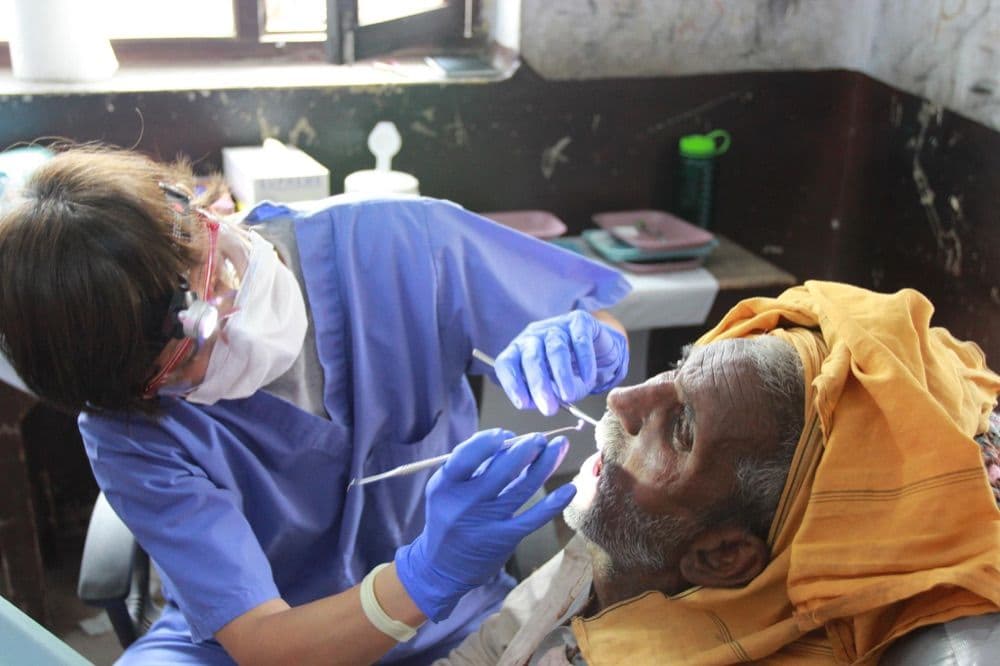Dental care during outreach shown by Reach Nepal.