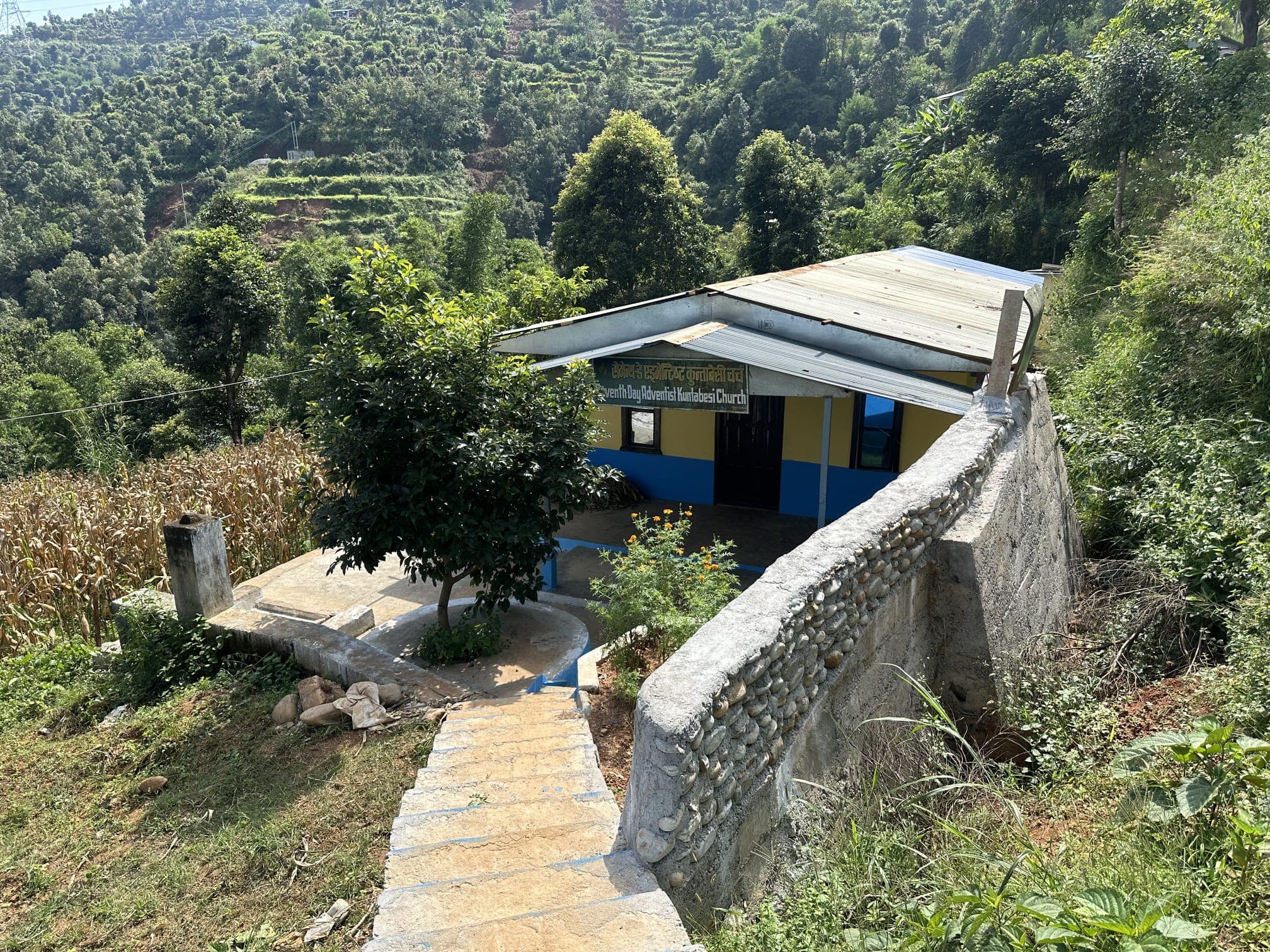 The completed Kuntabesi Sabbath School classroom beside the church.